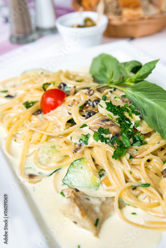 Spaghetti with aubergine and tomato on a the table