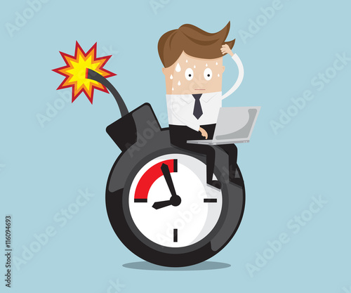businessman sitting working on time bomb near deadline