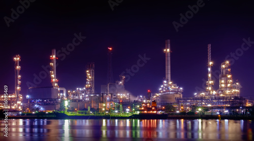 Oil refinery / Oil refinery reflex on river at twilight.