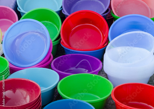 Colorful plastic bowls on the open market