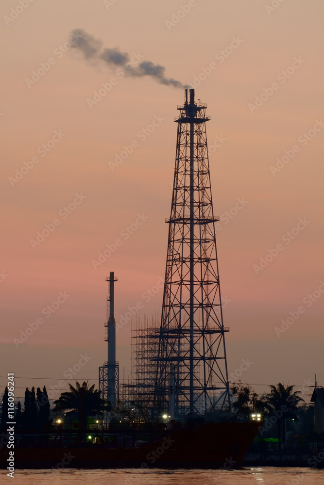 Fototapeta premium Oil refinery / Silhouette of oil refinery in the morning.