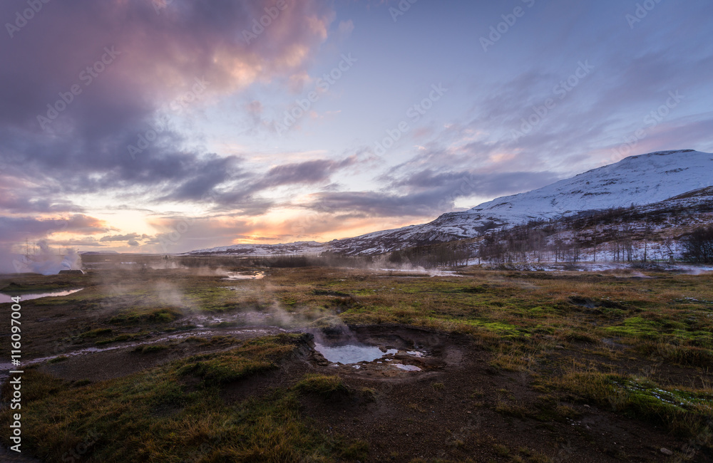 The colorful geyser landscape at the Haukadalur geothermal area, part of the golden circle route, in Iceland