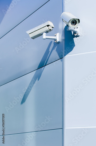 Surveillance camera on wall