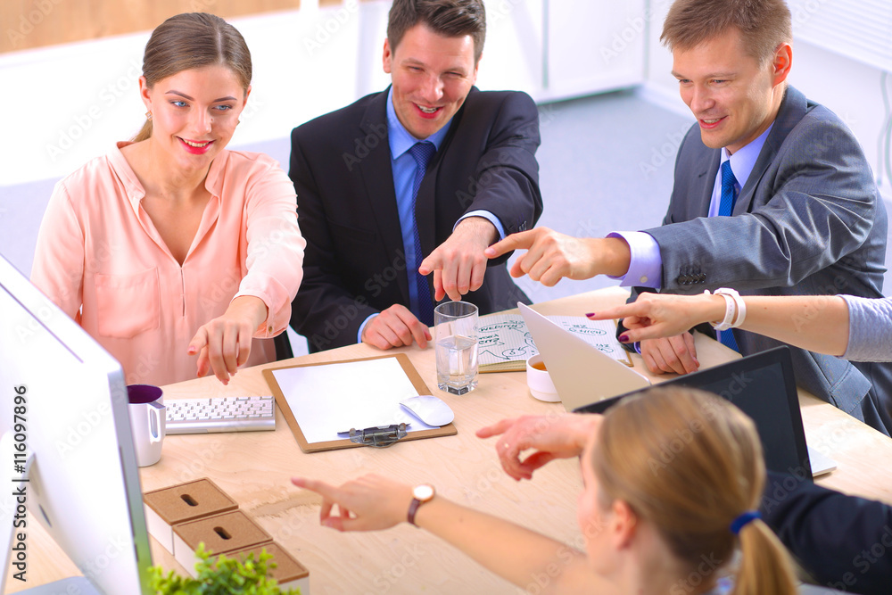 Business meeting - manager discussing work with his colleagues Business meeting - manager discussing work with his colleagues