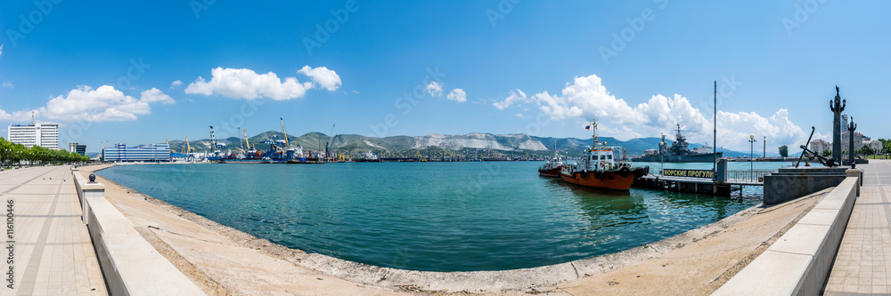 Panoramic view of Tsemes bay, port and sea-front in Novorossiysk, Russia. The inscription on the pier is 