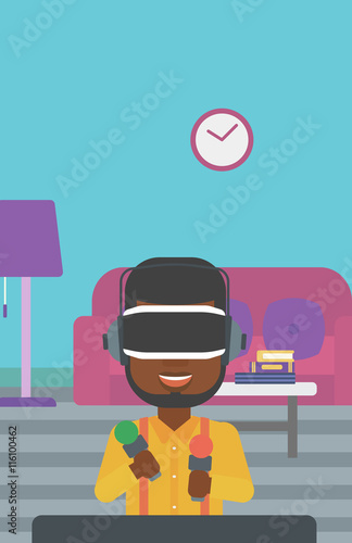 Man in virtual reality headset playing video game.