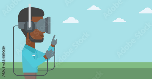 Man in virtual reality headset playing video game.