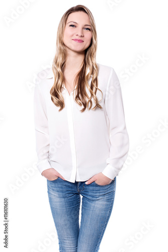 Smiling casual woman standing relaxed. © stockyimages