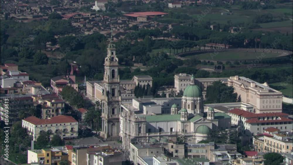 Flying Towards Blessed Virgin Of The Sacred Rosary Sanctuary, Central Pompei With Ruins Site, The Background Flying Towards Blessed Virgin Of The Sacred Rosary Sanctuary, Central Pompei With Ruins Site, The Background