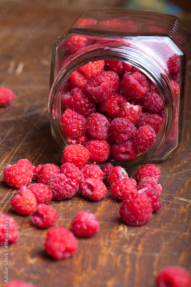 Lots of fresh bright red raspberries. Selective focus. Shallow d Lots of fresh bright red raspberries. Selective focus. Shallow d