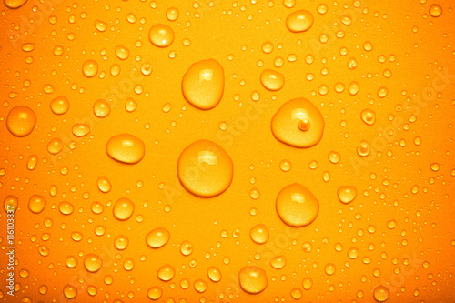 Drops of water on a color background. Orange. Toned