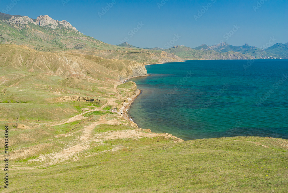 Crimean spring landscape near Karadag volcanic mountain range on a Black Sea shore, Crimean peninsula