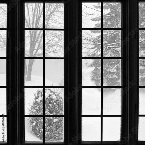 Snowstorm seen through a window photo