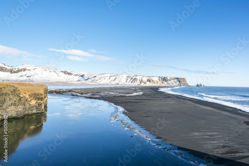 Fototapeta Naklejka Na Ścianę i Meble -  View of the Reynisfjara basalt black sand  beach from Dyrholaey. Vik, South Iceland.