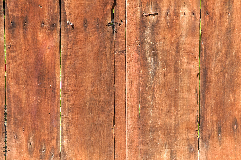 Old weathered brown grunge boards surface of wooden garden fence as background Old weathered brown grunge boards surface of wooden garden fence as background