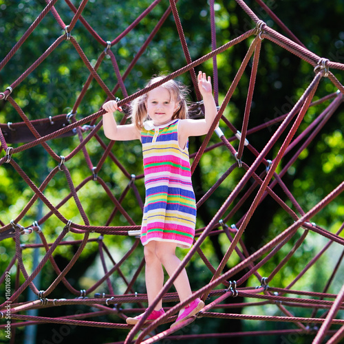 Child having fun on school yard playground © famveldman