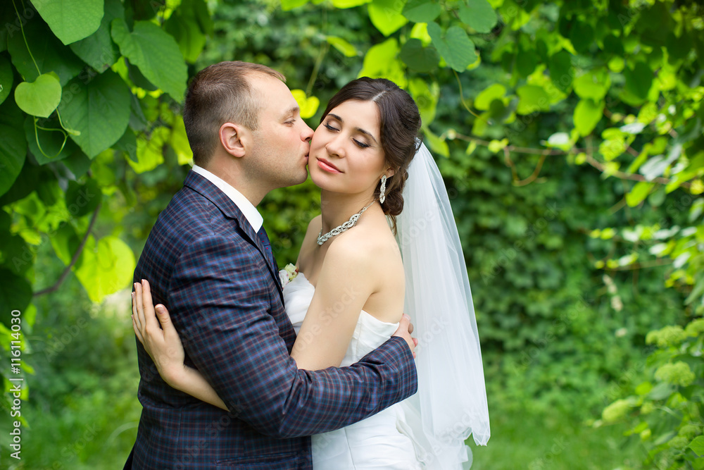 Groom in white shirt kissing bride hand. Very gentle photo Groom in white shirt kissing bride hand. Very gentle photo