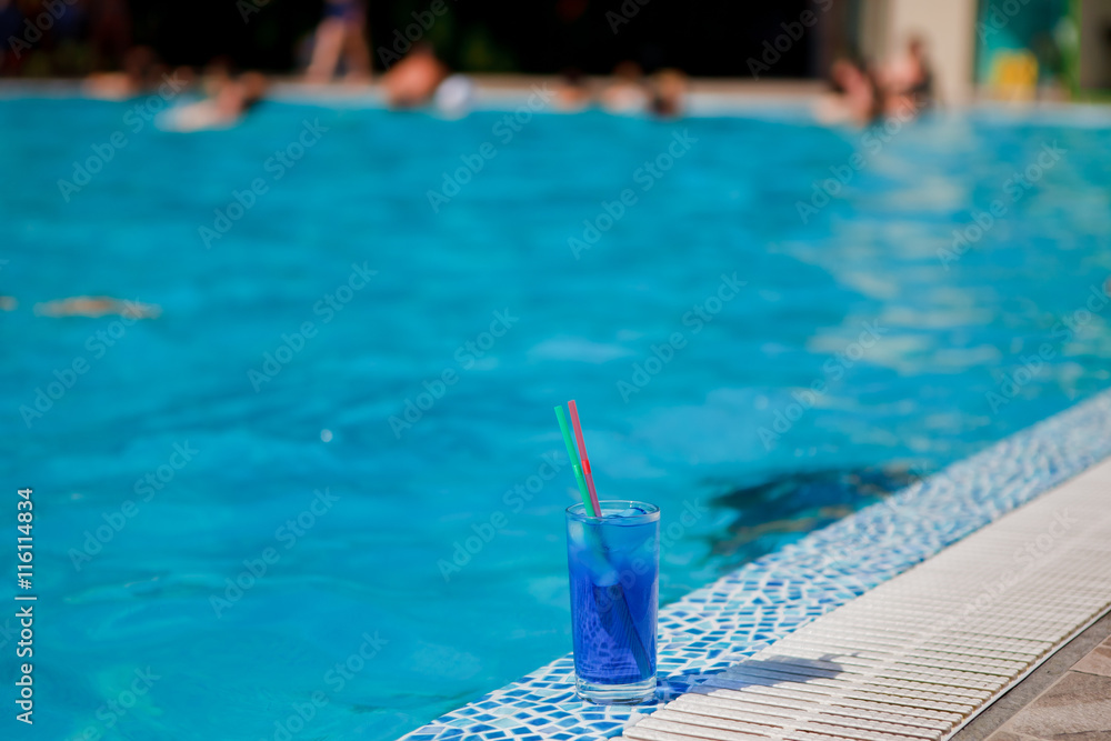 blue cocktail near pool