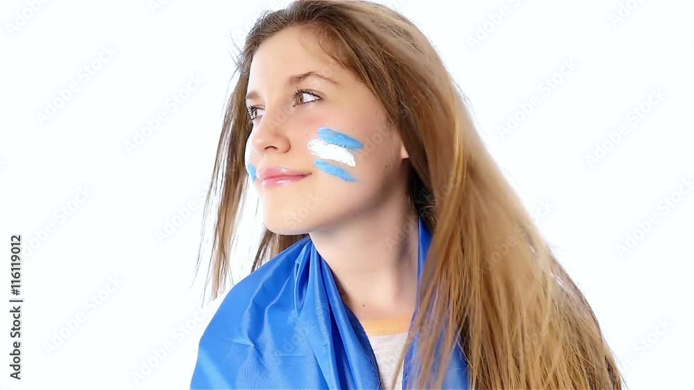Girl with Argentinian flag on her face smiling, slow motion Girl with Argentinian flag on her face smiling, slow motion