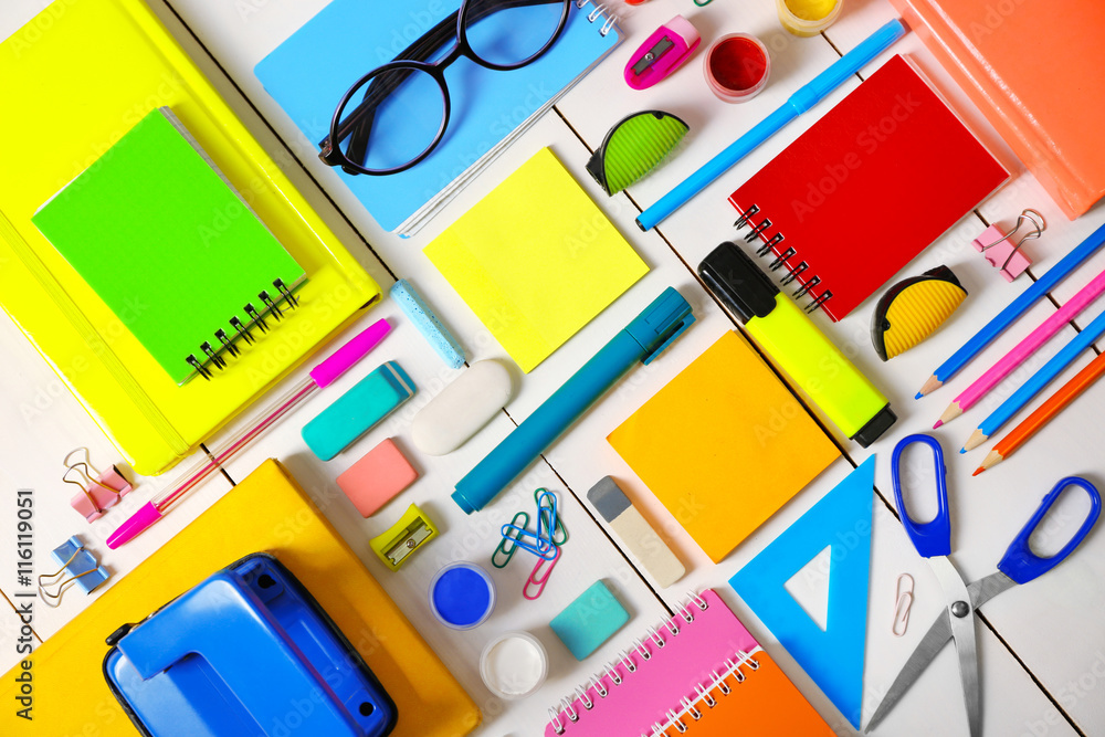 Flat lay of stationery on white wooden table background Flat lay of stationery on white wooden table background