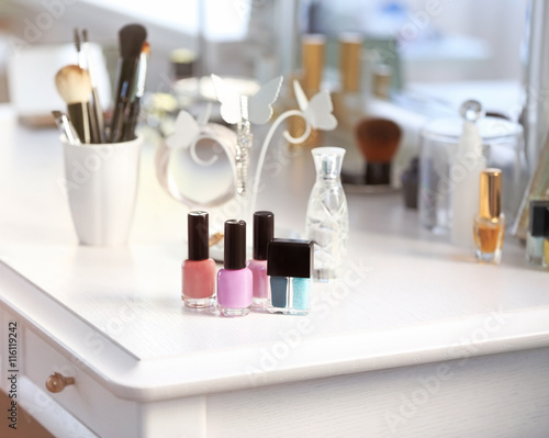 Nail polish set on light dressing table