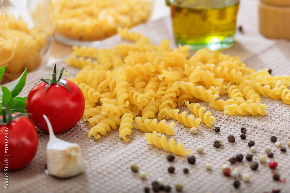 Raw fusilli pasta with vegetables