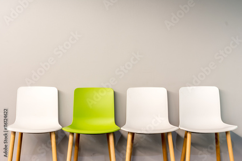 Modern chairs by the wall photo