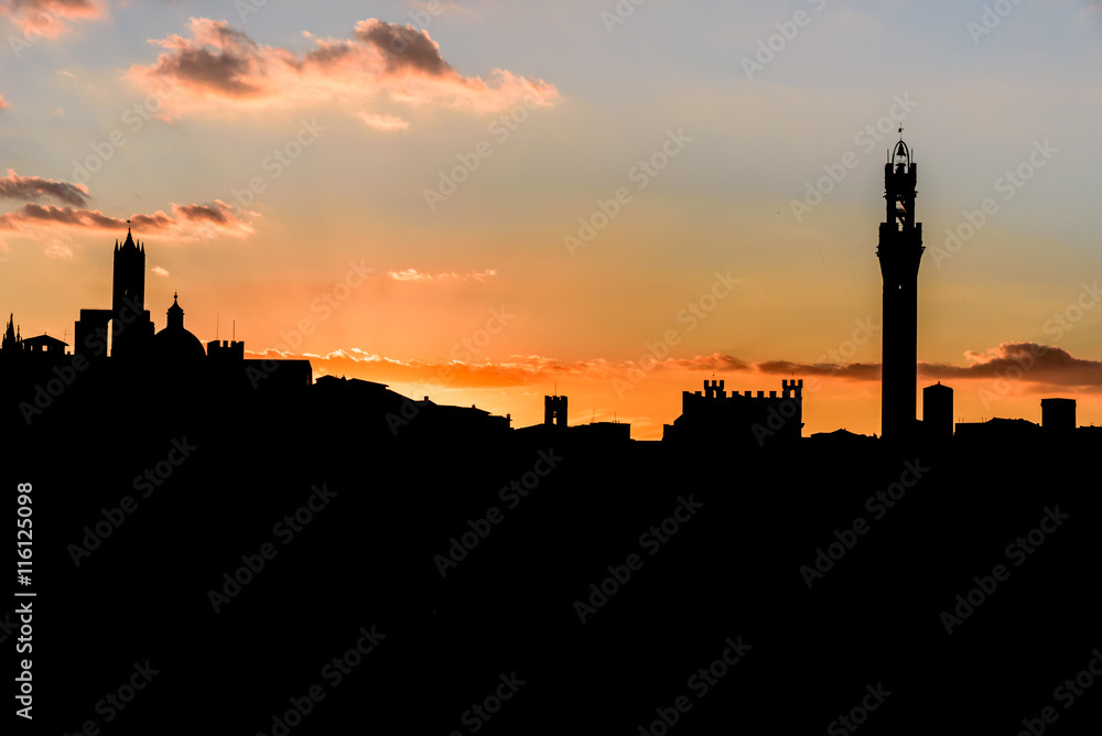 Silhouette of the city of Siena at sunset