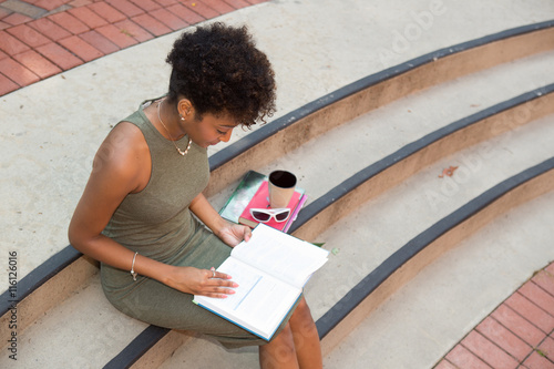 Young african american college student studying on campus photo