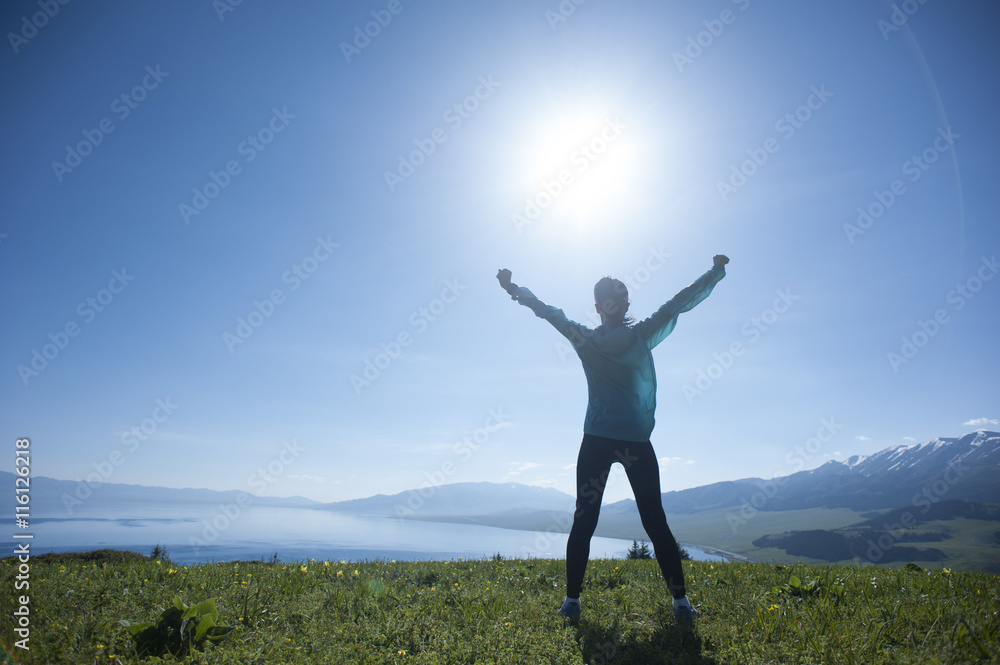 successful young woman open arms on sunrise mountain peak successful young woman open arms on sunrise mountain peak