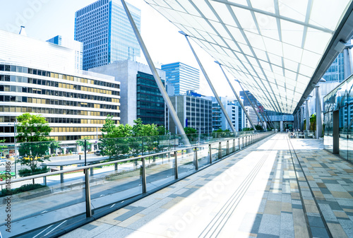 modern office buildings in downtown of tokyo from empty footpath