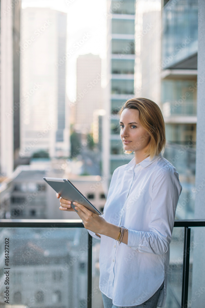 Portrait of young attractive businesswoman, Tablet on city background, Flare light, Shallow DOF.
Portrait of young attractive businesswoman, Tablet on city background, Flare light, Shallow DOF.