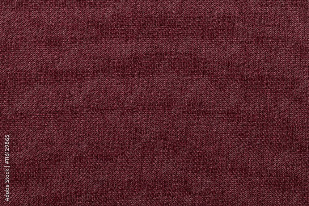 Fototapeta premium Dark red background from textile material. Fabric with natural texture.