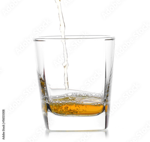 Glass of scotch whiskey  on a white background
