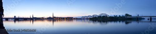 View on Riga cityline panorama in early morning over river Daugava. Panoramic montage from 11 images.