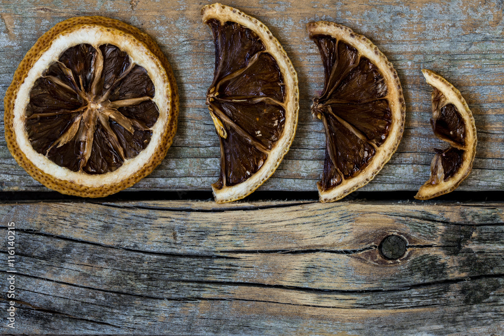 dried citrus on a beautiful wooden background dried citrus on a beautiful wooden background