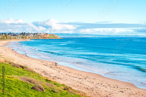 People walking along the beach