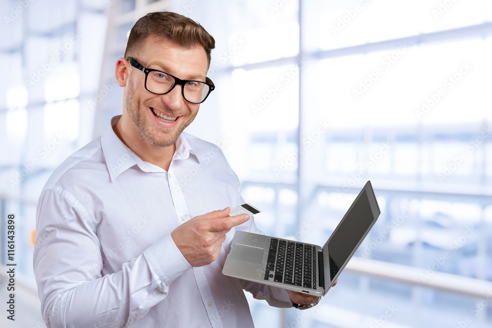 Portrait of young businessman with laptop Portrait of young businessman with laptop