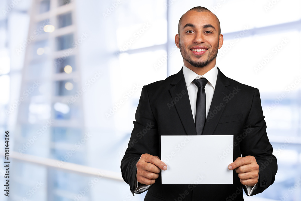 Portrait of a businessman showing a blank business card Portrait of a businessman showing a blank business card