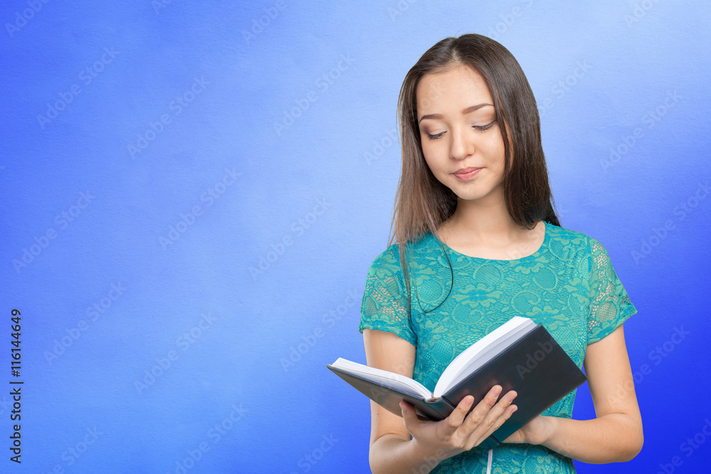 Woman university / college student holding book Woman university / college student holding book