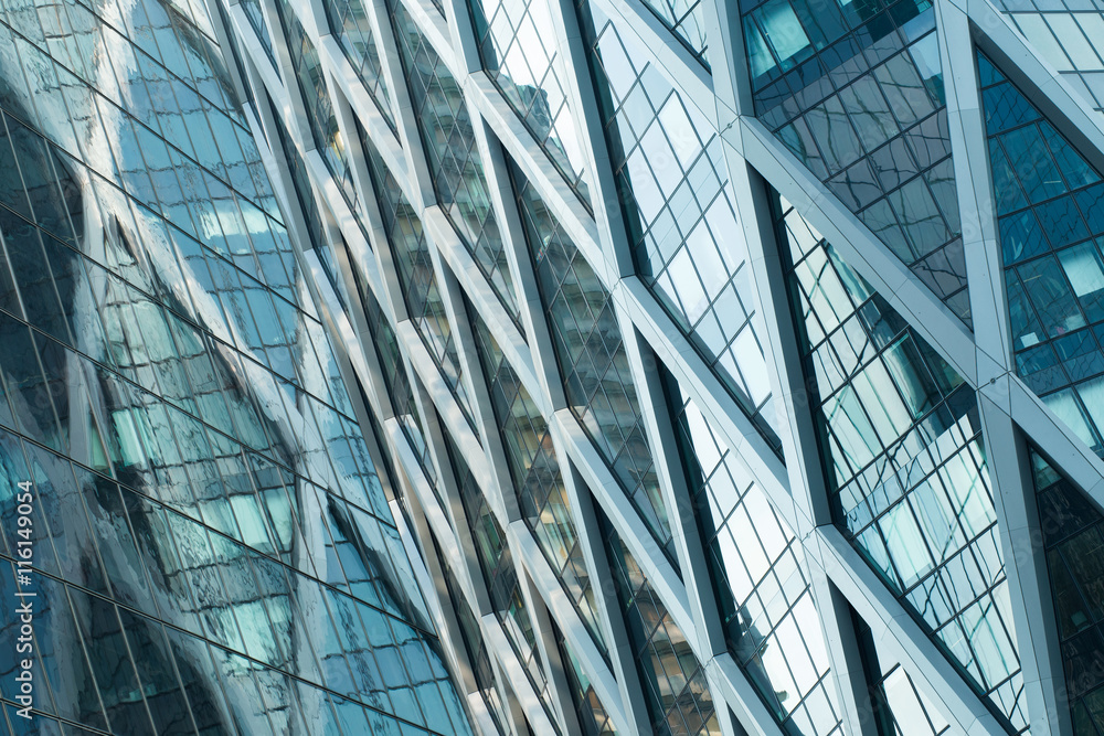 Obraz premium Skyscrapers with glass facade. Modern buildings in Paris business district. Concepts of economics, financial, future. Copy space for text. Dynamic composition. 