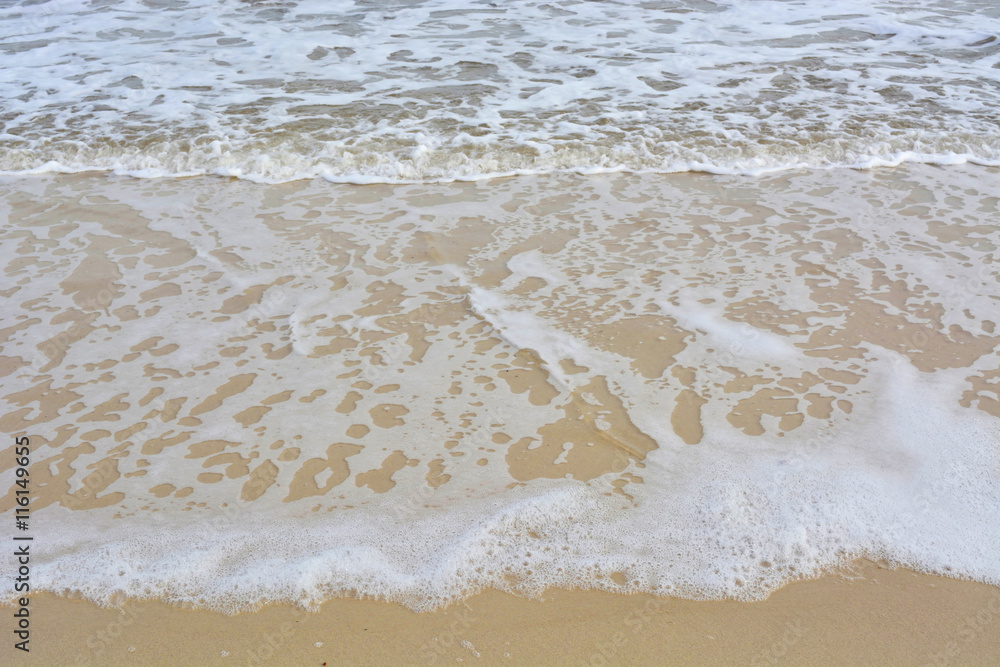 Wave ripples on sandy beach.