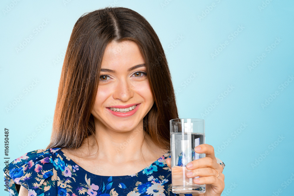 Young woman holding water glass Young woman holding water glass