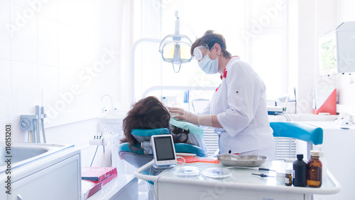 Dentist treats a patient