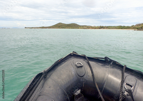 фотографія Black dingy boat in the sea