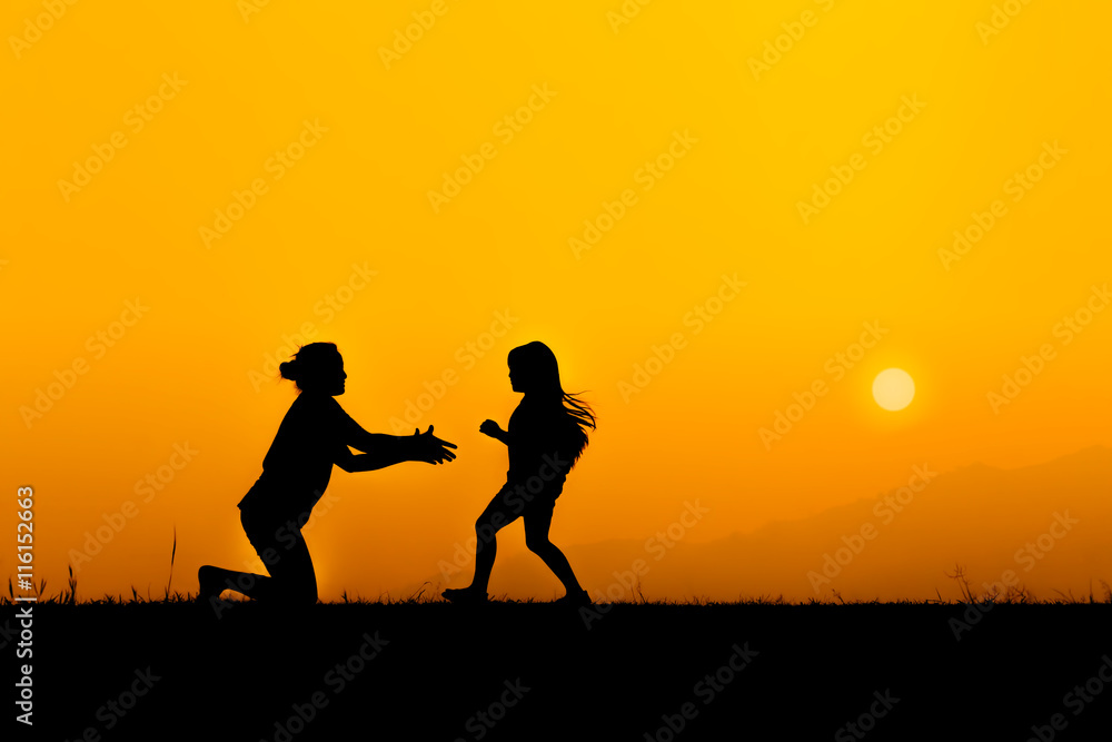 Silhouette of a family in sunset