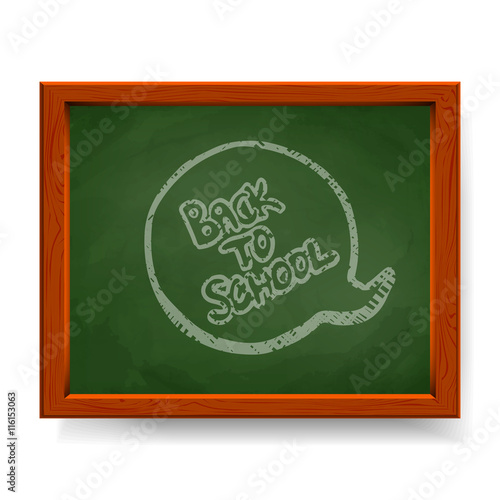 Back to school text written in chalk on green blackboard