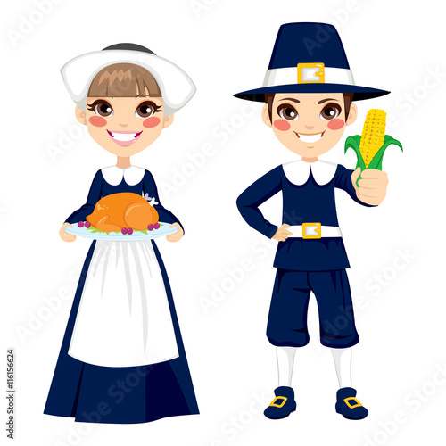 Two cute little children in pilgrim costume holding turkey and corn to celebrate Thanksgiving day
