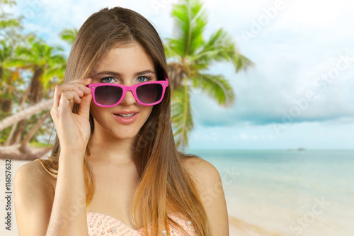 Woman in bikini and sunglasses isolated © fotofabrika