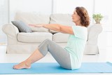 Mature woman doing stretching exercise